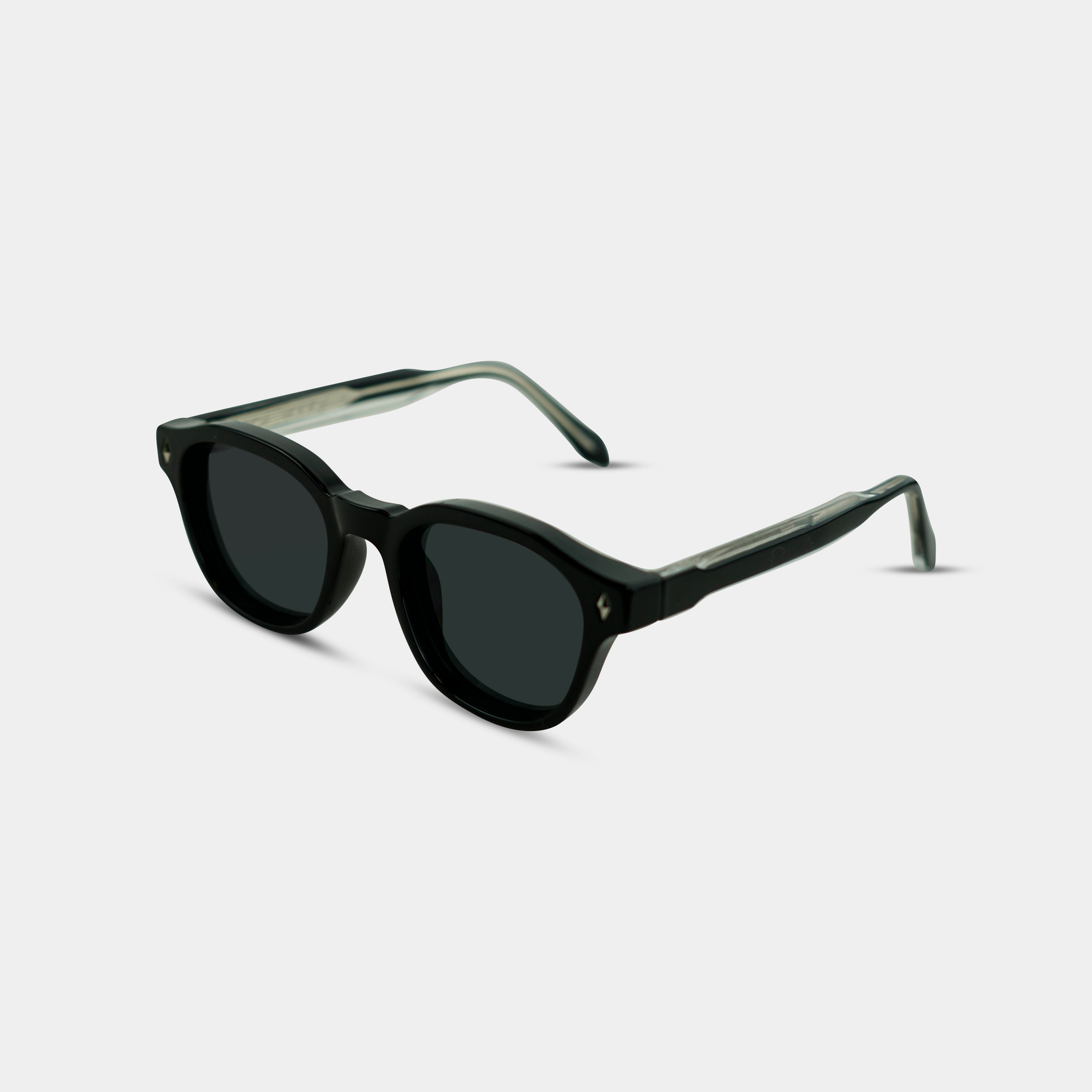 Hjalmer Blackout sunglasses in black with dark lenses, oblique angle