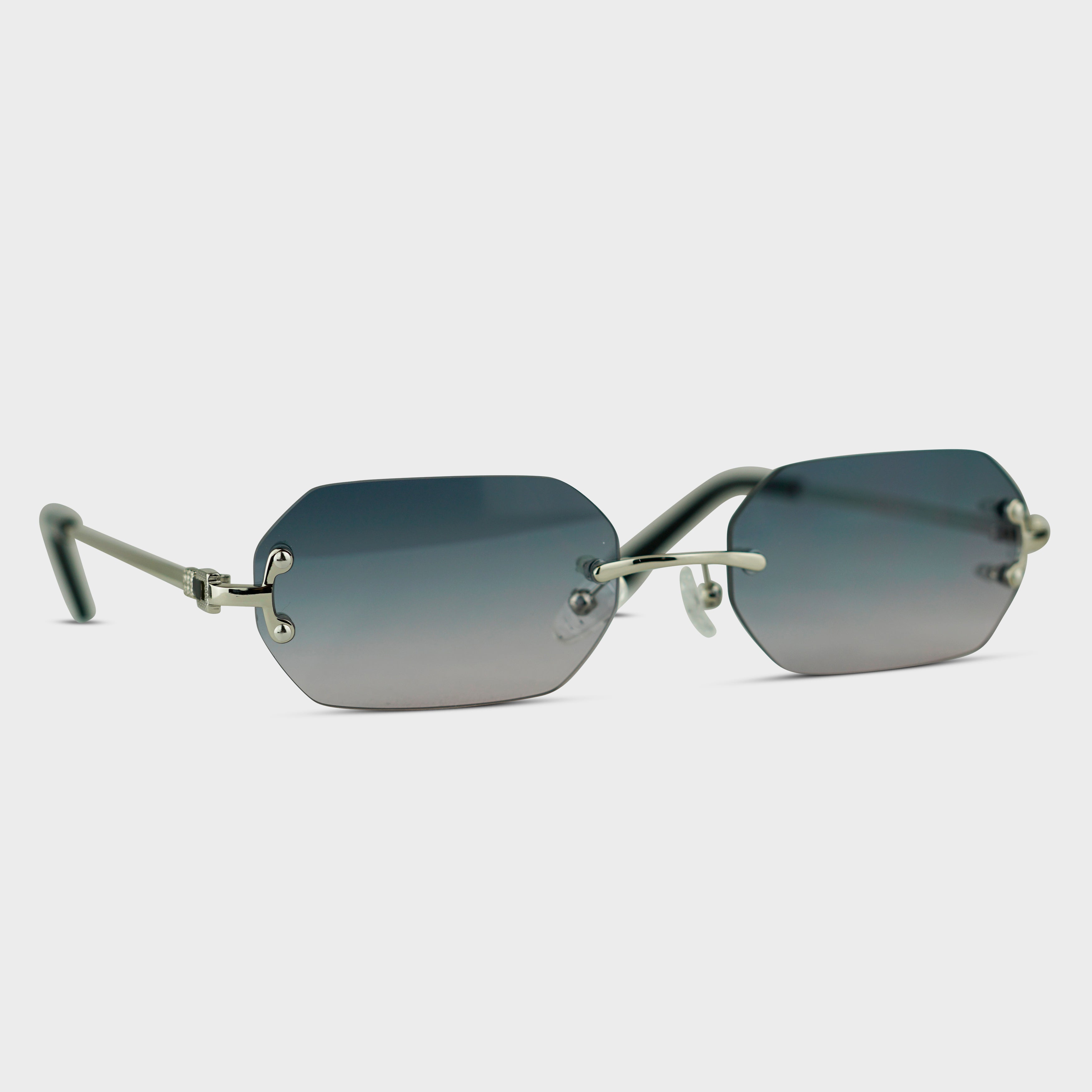 Rimless sunglasses with gray gradient lenses and silver temples
